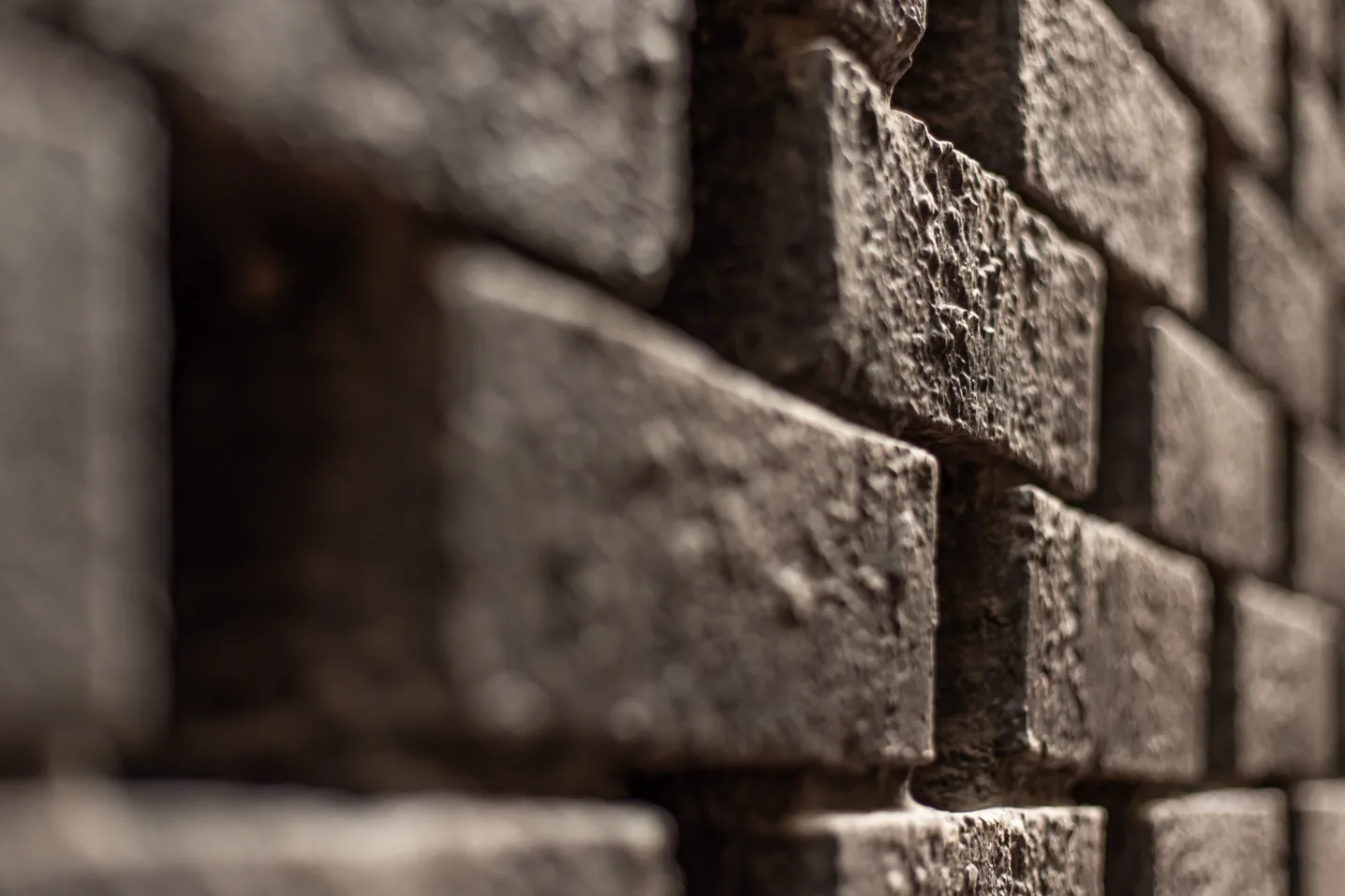 Close up photo of a red brick wall